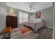 Bright bedroom with wood-look flooring, soft lighting, and a decorative rug at 16193 Sw 14Th Avenue Rd, Ocala, FL 34473