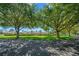 Inviting view of the community center framed by mature trees, showcasing the beautifully landscaped grounds at 16193 Sw 14Th Avenue Rd, Ocala, FL 34473