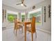 Cozy dining area surrounded by windows and a view of the backyard at 16193 Sw 14Th Avenue Rd, Ocala, FL 34473