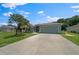 Charming single-story home featuring a well-maintained lawn, mature trees, and a two-car garage at 16193 Sw 14Th Avenue Rd, Ocala, FL 34473