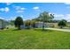A charming home boasts a verdant lawn and welcoming curb appeal at 16193 Sw 14Th Avenue Rd, Ocala, FL 34473