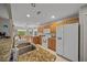 Bright kitchen features granite counters, wood cabinets, white appliances, and a stainless sink at 16193 Sw 14Th Avenue Rd, Ocala, FL 34473