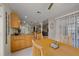 Kitchen transitions to dining area, with granite countertops and wood cabinets at 16193 Sw 14Th Avenue Rd, Ocala, FL 34473