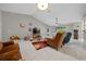 Large living room with tile flooring and neutral walls open to the kitchen at 16193 Sw 14Th Avenue Rd, Ocala, FL 34473