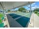 Well-maintained shuffleboard courts under a shaded structure, providing a recreational amenity for residents at 16193 Sw 14Th Avenue Rd, Ocala, FL 34473