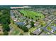 Lovely homes line the street with a long green space in the background at 16193 Sw 14Th Avenue Rd, Ocala, FL 34473