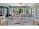 Bright sun room with large windows, tile flooring, and comfortable seating at 16193 Sw 14Th Avenue Rd, Ocala, FL 34473