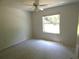 Vacant bedroom with a window and ceiling fan at 19026 Sw 100Th Pl, Dunnellon, FL 34432