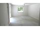 Bright bedroom with a ceiling fan, window, and glass sliding doors leading to outdoors at 19026 Sw 100Th Pl, Dunnellon, FL 34432