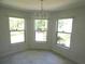 Bright dining area featuring large windows that offer plenty of natural light at 19026 Sw 100Th Pl, Dunnellon, FL 34432
