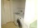 Laundry area features washer, dryer, and a closet for storage at 19026 Sw 100Th Pl, Dunnellon, FL 34432