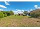 Backyard with storage shed and house in the background at 21 Pine Trace Run, Ocala, FL 34472