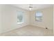 Inviting bedroom featuring tile flooring, natural light, and ample space, perfect for creating a cozy retreat at 21 Pine Trace Run, Ocala, FL 34472