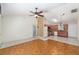 Open-concept living room with tile floors and a view of the adjacent kitchen at 21 Pine Trace Run, Ocala, FL 34472