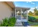 Enclosed patio features neutral tiling, screens, and natural lighting at 21 Pine Trace Run, Ocala, FL 34472