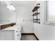 Stylish bathroom with a double sink vanity, marble countertop, and industrial shelves at 2146 Ne 9Th St, Ocala, FL 34470