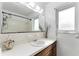 Bathroom featuring vanity, large mirror, window, bathtub and shower at 2146 Ne 9Th St, Ocala, FL 34470