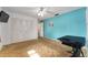 Bedroom featuring vintage carpeting, closet, and blue accent wall at 2146 Ne 9Th St, Ocala, FL 34470