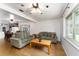 The living room with wood floors, couches, and a large window overlooking the backyard at 2146 Ne 9Th St, Ocala, FL 34470