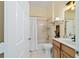 Bathroom featuring bath tub with shower, vanity sink, and tiled flooring at 2631 Sw 20Th Cir, Ocala, FL 34471