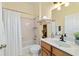 Bright bathroom features a shower-tub, white vanity, and decor, creating a relaxing and functional space at 2631 Sw 20Th Cir, Ocala, FL 34471