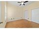 Bedroom with ceiling fan, wood flooring, and double door closets at 2631 Sw 20Th Cir, Ocala, FL 34471
