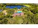 Community amenities including a pristine pool, and lush trees at 2631 Sw 20Th Cir, Ocala, FL 34471