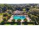 Aerial view of community pool, showing palm trees and ample lounge space at 2631 Sw 20Th Cir, Ocala, FL 34471