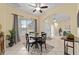Charming dining area with a round table, large window, and easy access to the foyer at 2631 Sw 20Th Cir, Ocala, FL 34471