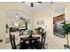 Dining area view open to kitchen and living areas, with tile flooring and natural light at 2631 Sw 20Th Cir, Ocala, FL 34471