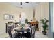 A bright dining area featuring a black round table, tiled floors, and neutral paint at 2631 Sw 20Th Cir, Ocala, FL 34471