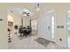 Welcoming foyer with arched entryways, tile flooring, a ceiling fan, and a view of the dining area at 2631 Sw 20Th Cir, Ocala, FL 34471
