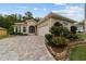 Well maintained home with a beautiful brick driveway, lovely landscaping, and attached two-car garage at 2631 Sw 20Th Cir, Ocala, FL 34471