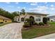 Inviting single Gathering home with lovely brick driveway, an attached garage and landscaped front yard at 2631 Sw 20Th Cir, Ocala, FL 34471