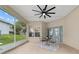 Covered lanai with tiled flooring, ceiling fan, and views of the backyard, creating a relaxing outdoor space at 2631 Sw 20Th Cir, Ocala, FL 34471