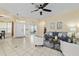 Light-filled living room featuring tile flooring, ceiling fan, and open floor plan at 2631 Sw 20Th Cir, Ocala, FL 34471