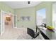 Office with French doors, tile flooring, ceiling fan, and built-in desk at 2631 Sw 20Th Cir, Ocala, FL 34471