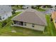 Aerial view of home featuring a screened in porch and manicured lawn at 2631 Sw 20Th Cir, Ocala, FL 34471