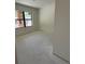 Unfinished bedroom with a large window, offering a blank canvas for customization at 415 Se 1St Ave # 103-B, Ocala, FL 34471