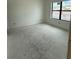 Bright unfinished bedroom awaiting completion, featuring a large window and neutral walls at 415 Se 1St Ave # 103-B, Ocala, FL 34471
