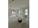 Unfinished living room with modern windows, a fireplace, and awaiting final touches at 415 Se 1St Ave # 103-B, Ocala, FL 34471