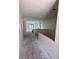 Spacious, unfinished living area ready for customization, showcasing open layout and natural light at 415 Se 1St Ave # 103-B, Ocala, FL 34471