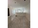 Unfinished living space with smooth concrete floors, prepped for finishing and design at 415 Se 1St Ave # 103-B, Ocala, FL 34471