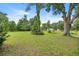 Expansive backyard with mature trees at 465 Ne 155Th Street Rd, Citra, FL 32113