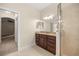 Bathroom with granite countertops, dark wood cabinets, and a glass-enclosed shower at 465 Ne 155Th Street Rd, Citra, FL 32113