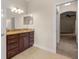Bathroom featuring dark cabinets, granite countertops, and modern lighting fixtures at 465 Ne 155Th Street Rd, Citra, FL 32113
