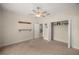 Cozy bedroom with carpeted floors, ceiling fan, closet, and neutral walls at 465 Ne 155Th Street Rd, Citra, FL 32113