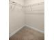 Empty closet with wire shelving and carpeted floor at 465 Ne 155Th Street Rd, Citra, FL 32113