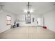 Spacious garage with water heater and door leading to inside the home at 465 Ne 155Th Street Rd, Citra, FL 32113