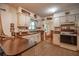 Traditional-style kitchen with white cabinetry and a laminate countertop at 465 Ne 155Th Street Rd, Citra, FL 32113